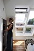 VELUX white roof windows installed in a bedroom - Roofinglines