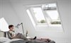 VELUX INTEGRA white roof windows installed in a bedroom - Roofinglines